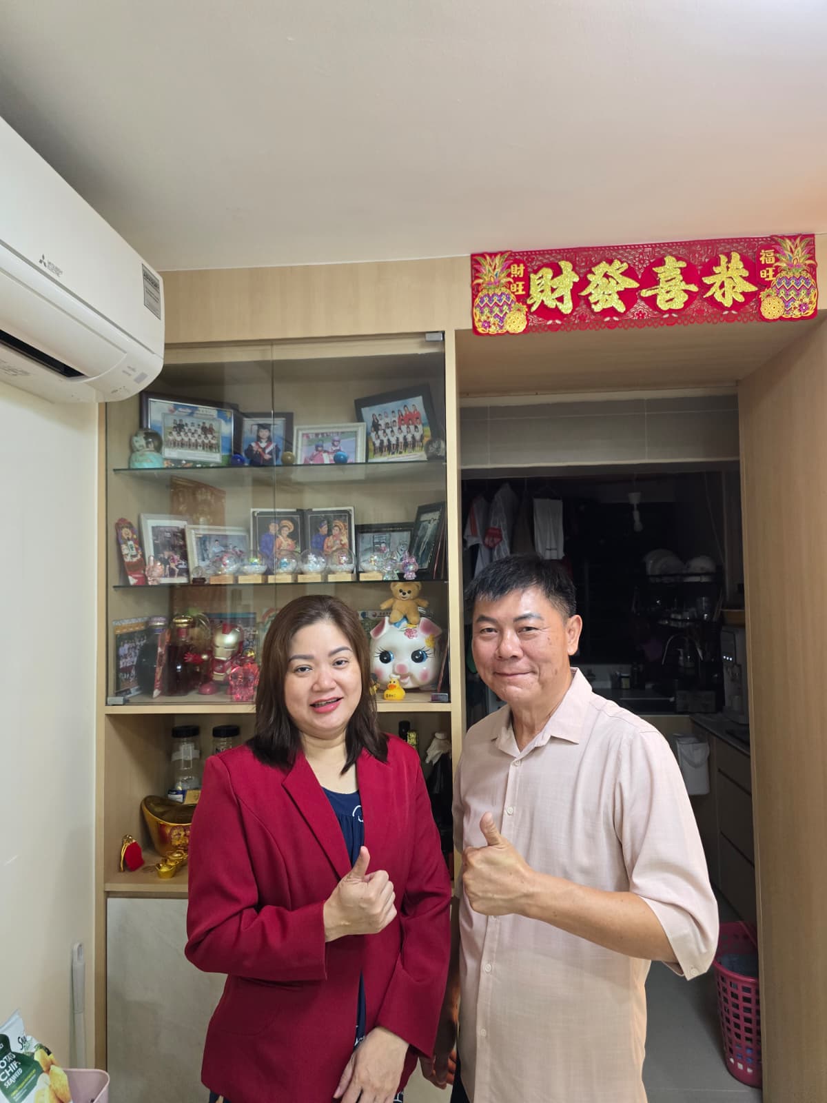 Jason from A1 Electrician SG with a happy customer in their Singapore home (2)